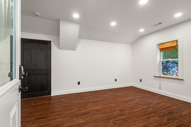 unfurnished room with recessed lighting, baseboards, visible vents, and dark wood finished floors