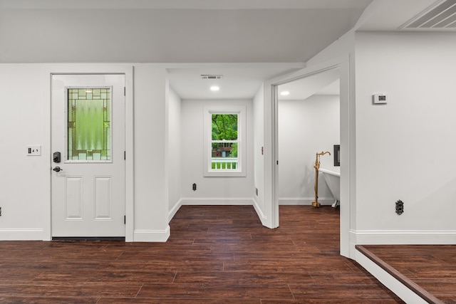 entrance foyer with recessed lighting, baseboards, visible vents, and wood finished floors
