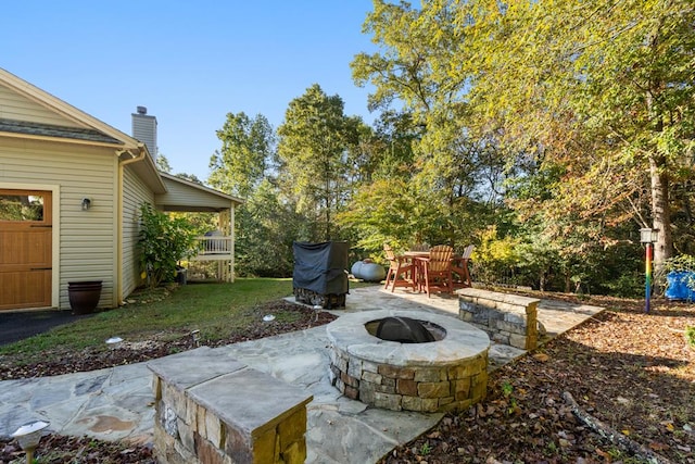 view of patio featuring an outdoor fire pit