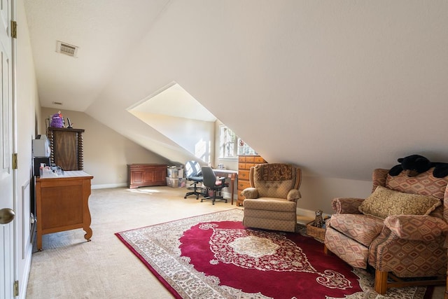 sitting room with carpet floors and lofted ceiling