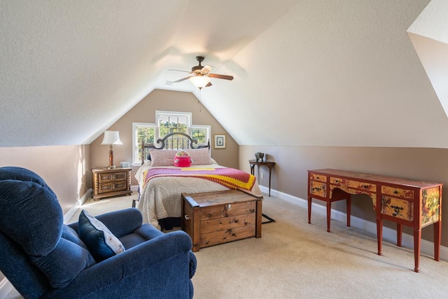 bedroom with ceiling fan, lofted ceiling, and light carpet