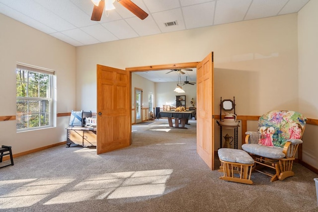 sitting room with a drop ceiling, pool table, ceiling fan, and carpet flooring