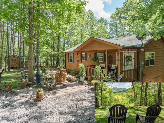 243 Havenwood Ln, Murphy, NC 28906 - view of front facade featuring a storage unit, an outbuilding, covered porch, and a front lawn