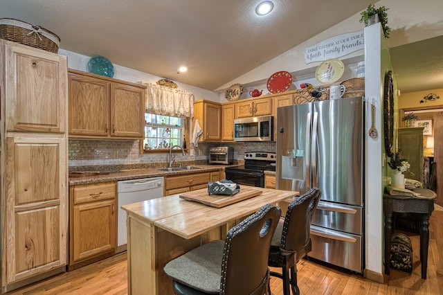 243 Havenwood Ln, Murphy, NC 28906 - kitchen featuring stainless steel appliances, a sink, vaulted ceiling, decorative backsplash, and wood counters