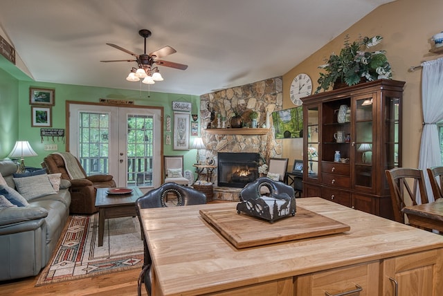 243 Havenwood Ln, Murphy, NC 28906 - dining room featuring ceiling fan, a stone fireplace, and wood finished floors