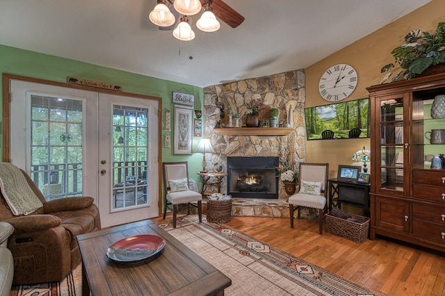 243 Havenwood Ln, Murphy, NC 28906 - living area featuring wood finished floors, a stone fireplace, and a ceiling fan