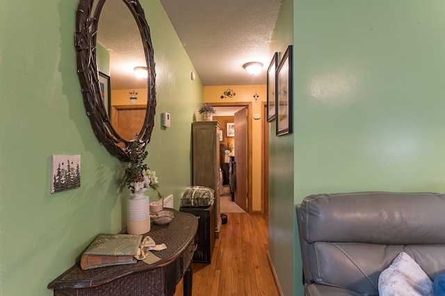 243 Havenwood Ln, Murphy, NC 28906 - hallway featuring a textured ceiling and wood finished floors