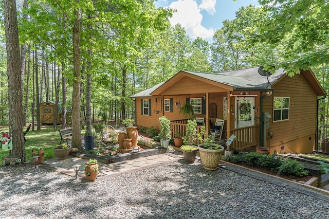 243 Havenwood Ln, Murphy, NC 28906 - view of front facade with a storage unit, an outbuilding, and a porch