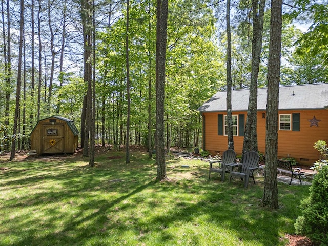 243 Havenwood Ln, Murphy, NC 28906 - view of grassy yard featuring a storage unit and an outbuilding
