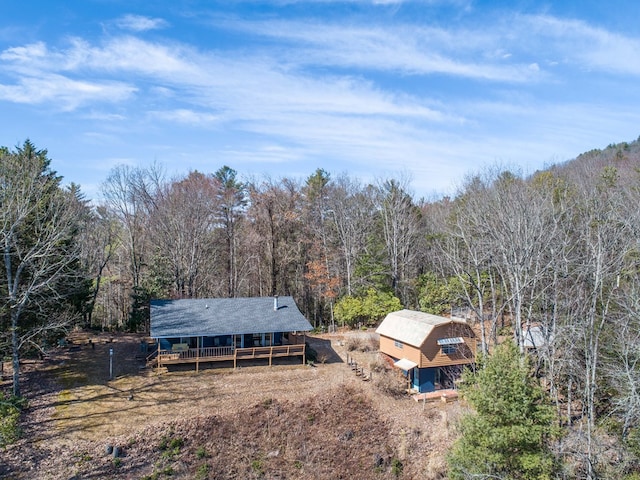 birds eye view of property with a wooded view