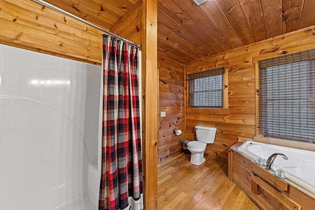 full bath with hardwood / wood-style floors, a garden tub, curtained shower, wooden ceiling, and toilet