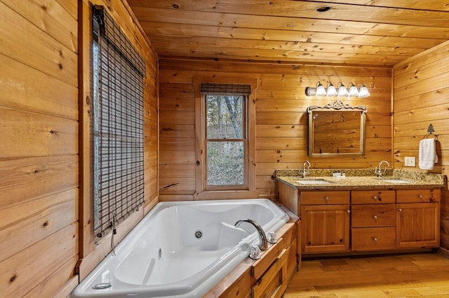 full bathroom with a sink, a jetted tub, wood-type flooring, double vanity, and wood ceiling