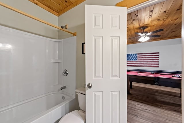 bathroom with toilet, wood ceiling, shower / tub combination, and ceiling fan