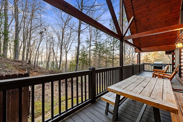 wooden terrace featuring a grill