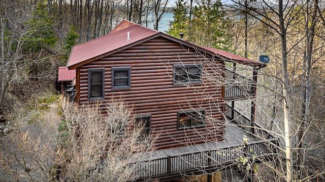 view of property exterior with metal roof