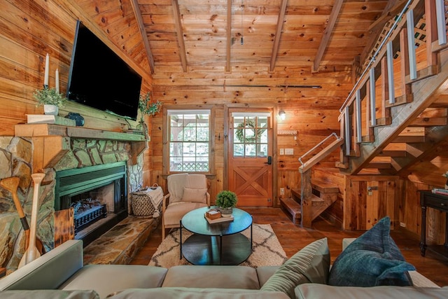 living room featuring hardwood / wood-style flooring, wood ceiling, wooden walls, and lofted ceiling with beams