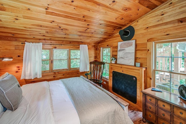 bedroom featuring hardwood / wood-style flooring, vaulted ceiling, wood ceiling, and wood walls