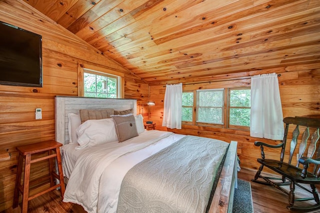 bedroom with wood ceiling, wooden walls, vaulted ceiling, and hardwood / wood-style flooring