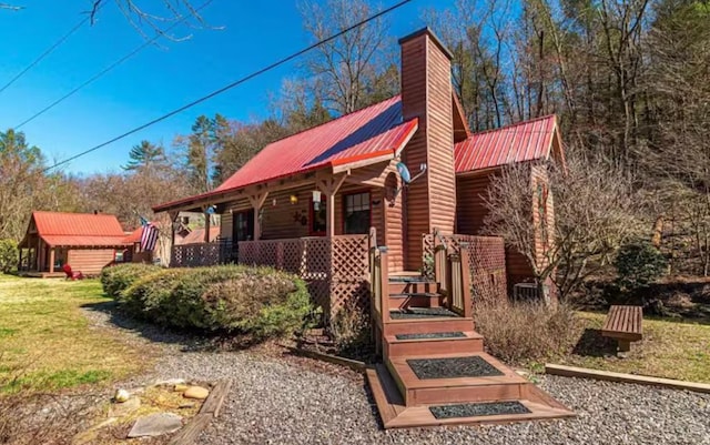 view of front of home with a porch and a front yard