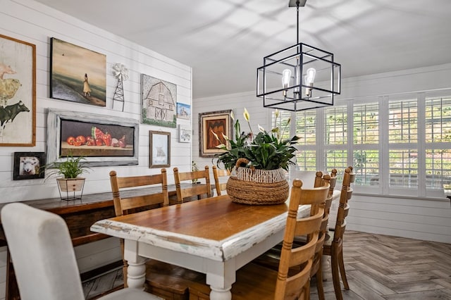 dining space featuring an inviting chandelier and a healthy amount of sunlight