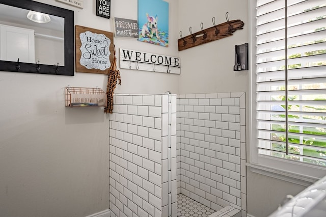 bathroom with tiled shower