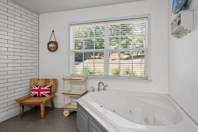 full bath featuring a tub with jets and tile patterned floors