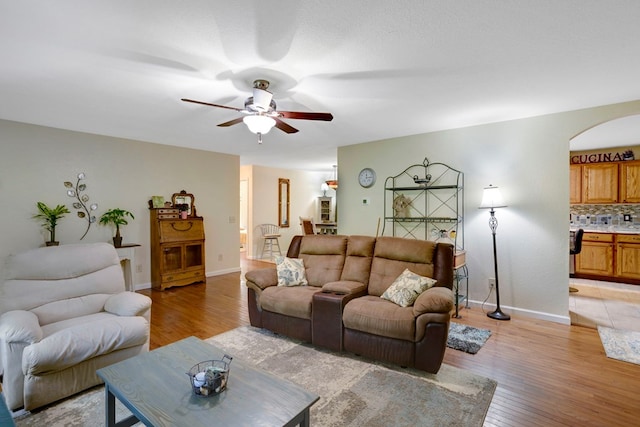 49 Hampton Ln, Hayesville, NC 28904 - living area featuring light wood-style floors, ceiling fan, arched walkways, and baseboards