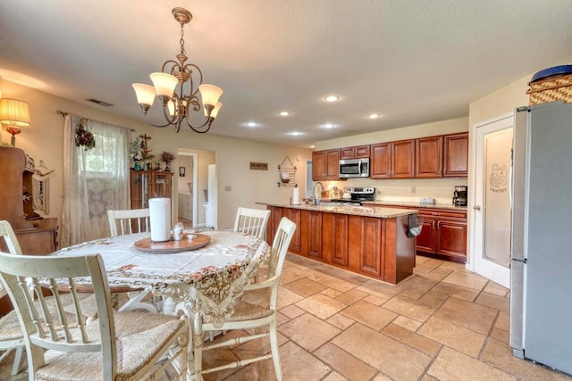 dining room with a notable chandelier and sink