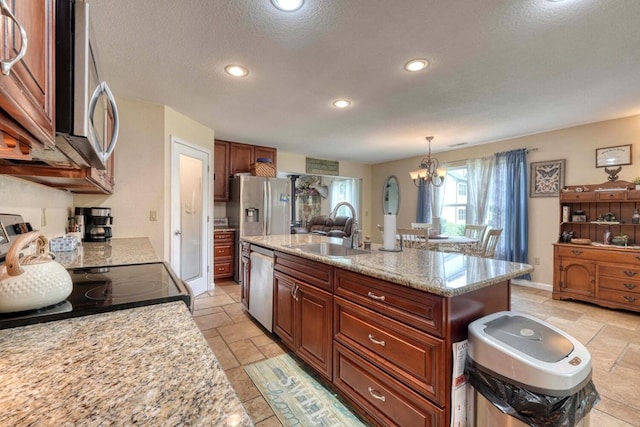 kitchen with light stone counters, stainless steel dishwasher, sink, decorative light fixtures, and a notable chandelier