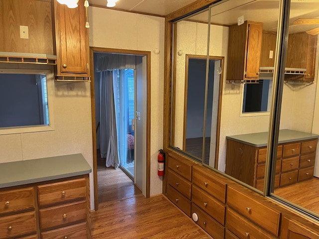 kitchen featuring brown cabinets and wood finished floors