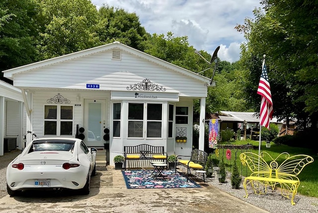 view of front of property featuring covered porch and central AC unit