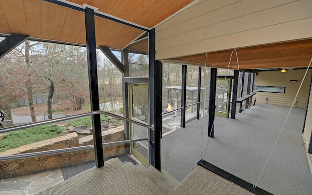 unfurnished sunroom with lofted ceiling and wood ceiling