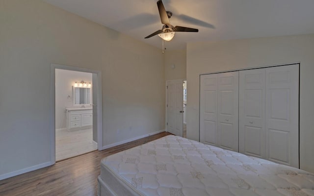 unfurnished bedroom with ceiling fan, light hardwood / wood-style floors, connected bathroom, and a closet