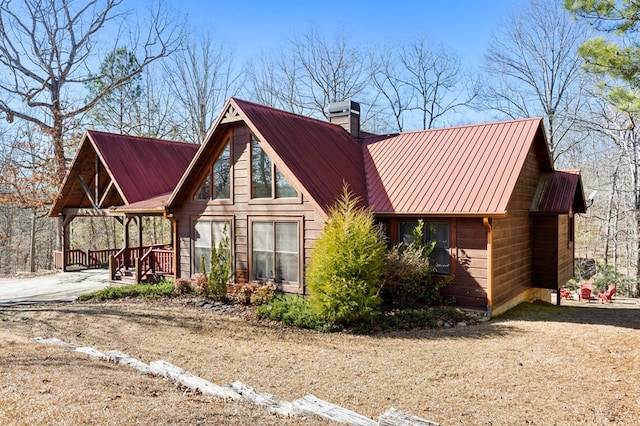 view of side of home featuring a porch