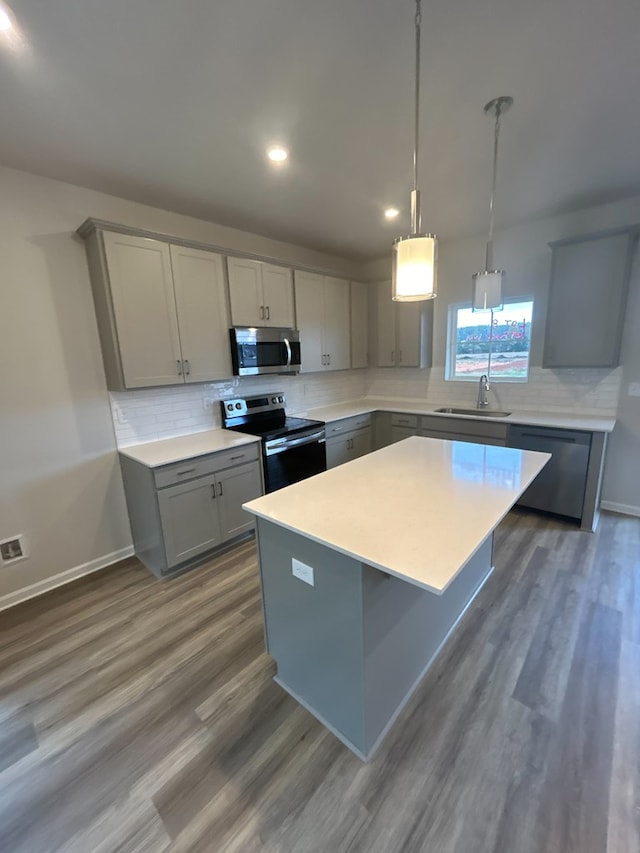 kitchen with appliances with stainless steel finishes and gray cabinets