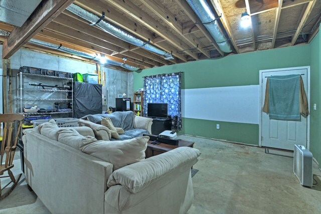 living room featuring concrete flooring