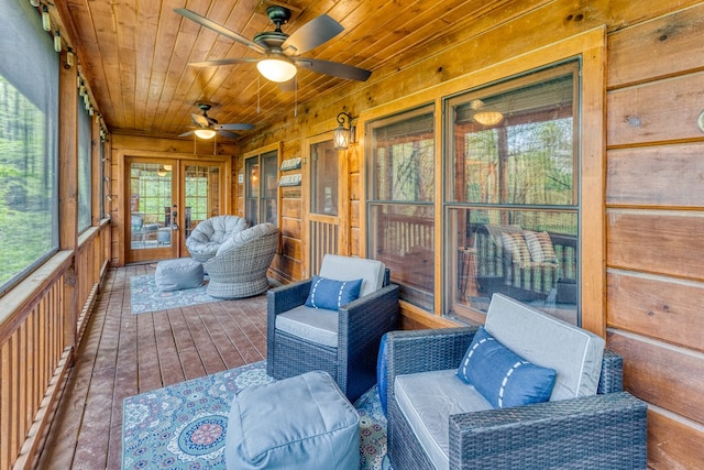 sunroom / solarium with french doors, a ceiling fan, and outdoor lounge area