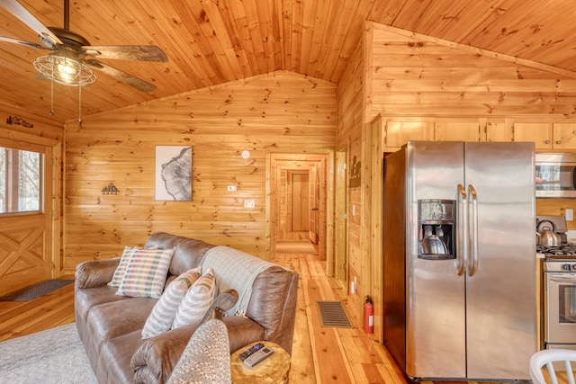 living room with wood ceiling, a ceiling fan, light wood finished floors, and lofted ceiling