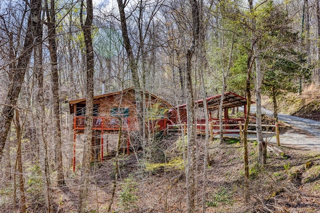view of outdoor structure with a view of trees