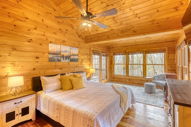 bedroom with wood ceiling, multiple windows, wood-type flooring, and vaulted ceiling