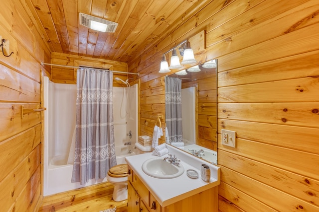 full bathroom featuring wooden walls, vanity, wooden ceiling, shower / tub combo, and visible vents