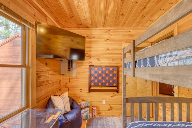 bedroom featuring wood ceiling, wood walls, and wood finished floors
