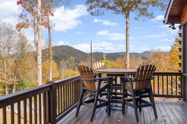 wooden deck with a mountain view