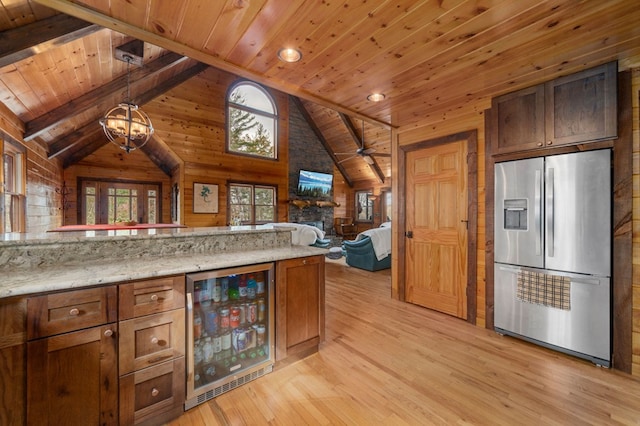 kitchen featuring stainless steel fridge with ice dispenser, light hardwood / wood-style flooring, beverage cooler, and wood ceiling