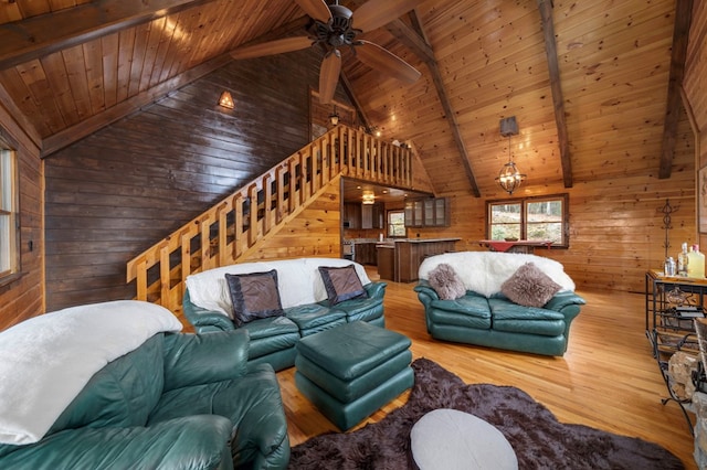 living room with wooden walls, hardwood / wood-style floors, and wooden ceiling