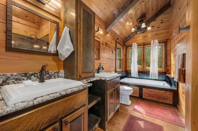 full bathroom featuring vanity, wooden walls, wood-type flooring, wooden ceiling, and vaulted ceiling with beams