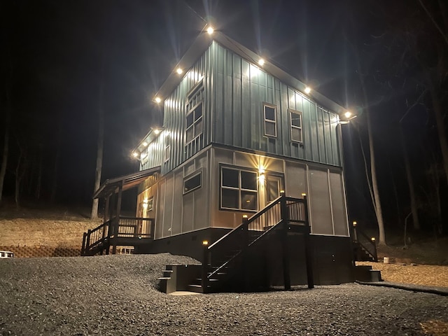 view of back house at night