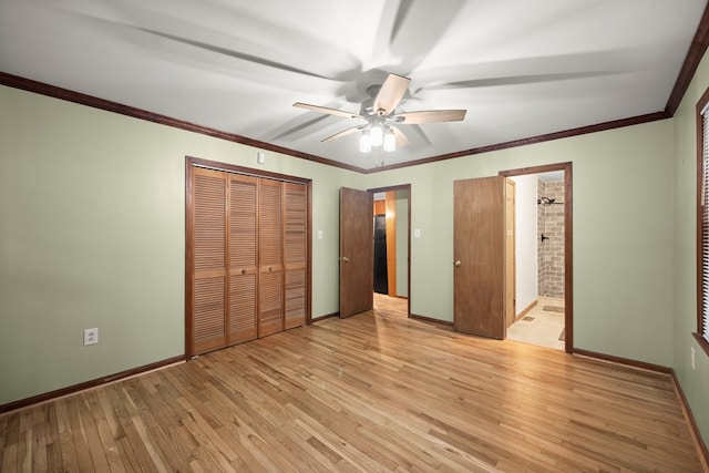 unfurnished bedroom with light wood-style floors, baseboards, and a closet