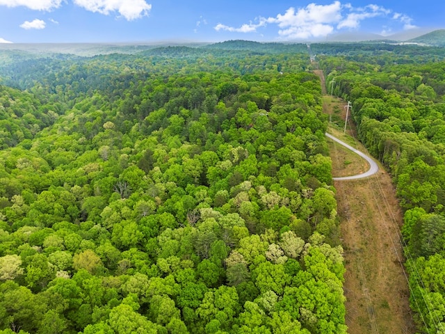 bird's eye view featuring a view of trees and a mountain view