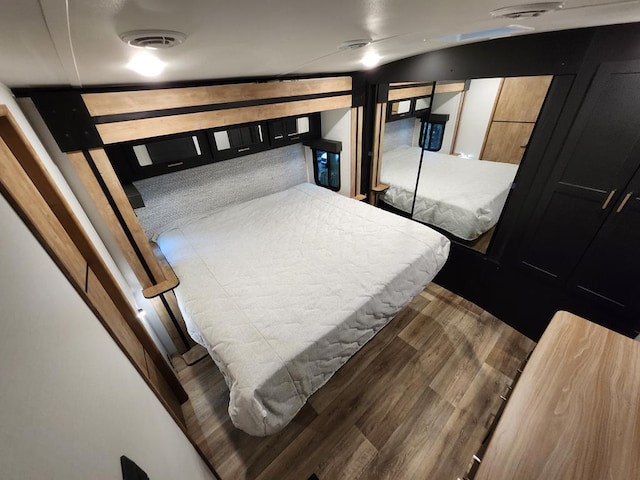 bedroom featuring wood-type flooring